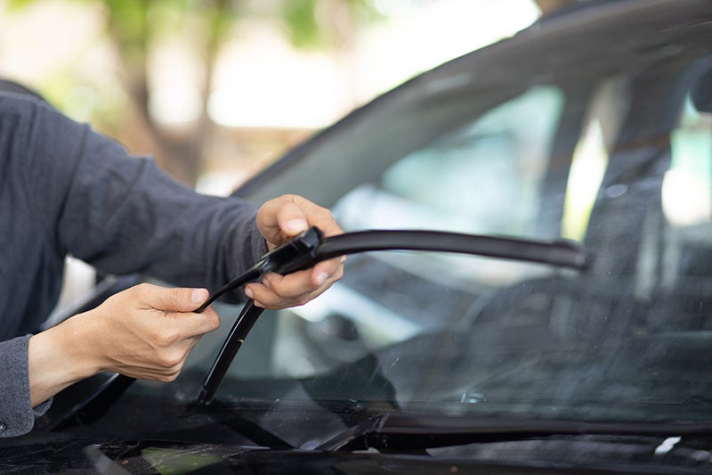 Technician repairing a windshield